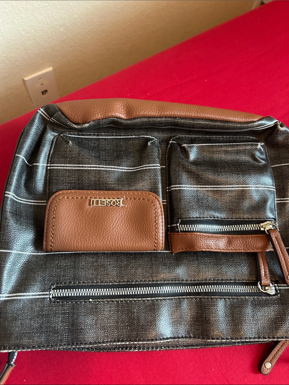 Rosetti Black and Brown Striped women’s Crossbody Sling. Looks new clean.